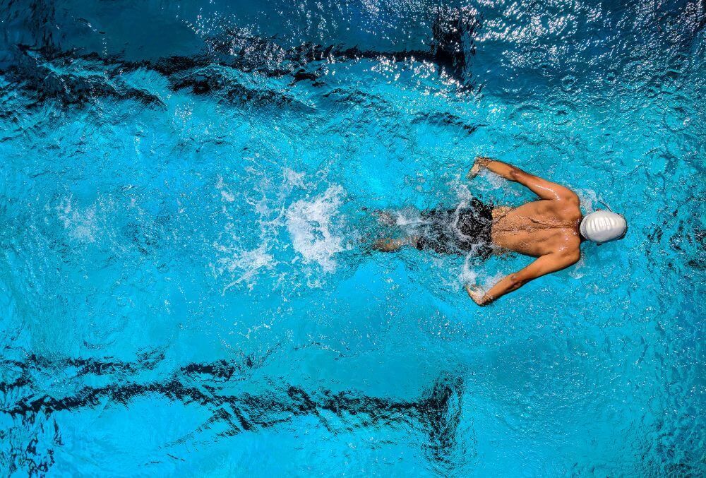 Man exercising through swimming