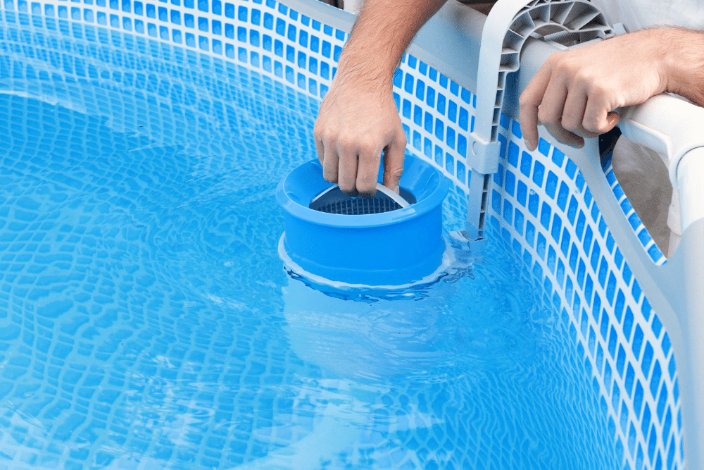 Man replacing swimming pool water filter