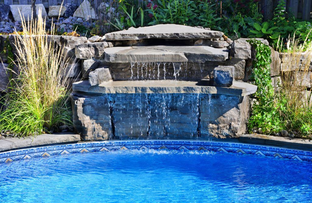 Rock waterfall feature in a swimming pool