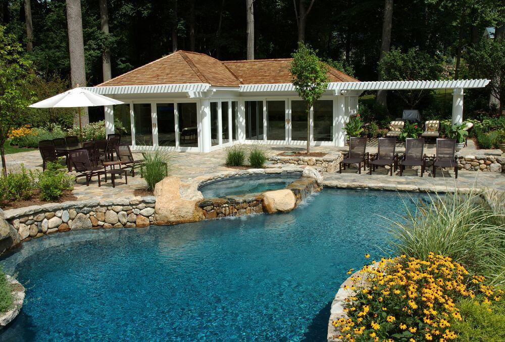 Spa and rock waterfall feature in a custom made swimming pool in a residential area