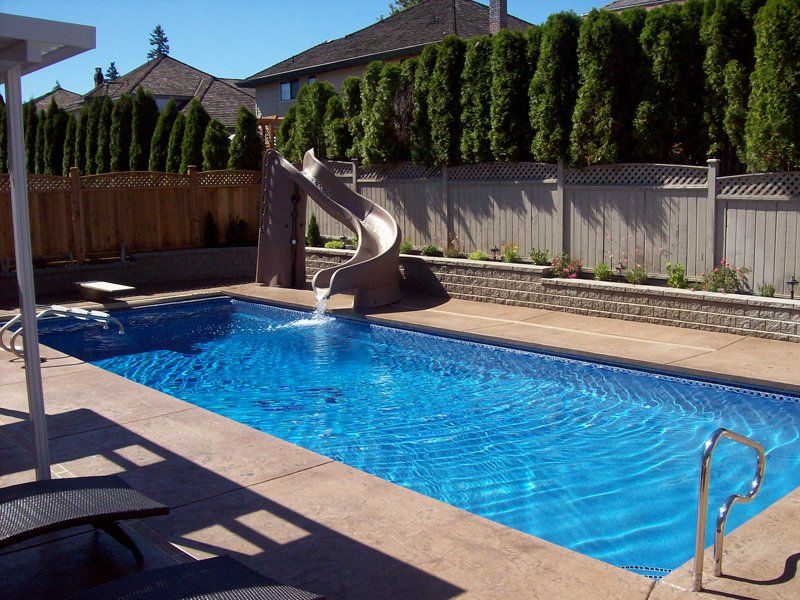 Rectangular residential pool with slide
