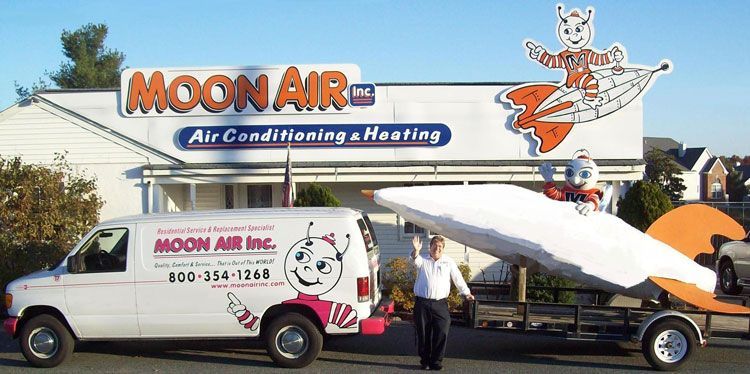 A Man is Standing in Front of a Moon Air Van - Elkton, MD - Moon Air