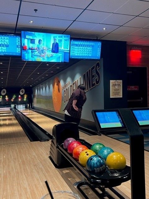 a bowling alley with a sign that says golden lanes