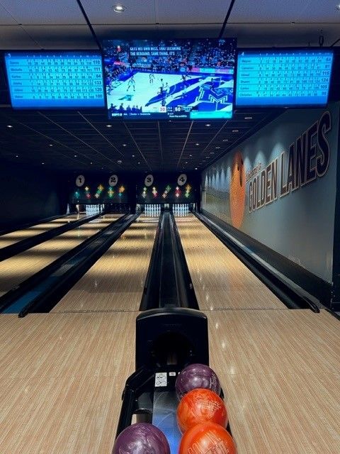 a bowling alley with a sign that says golden lanes