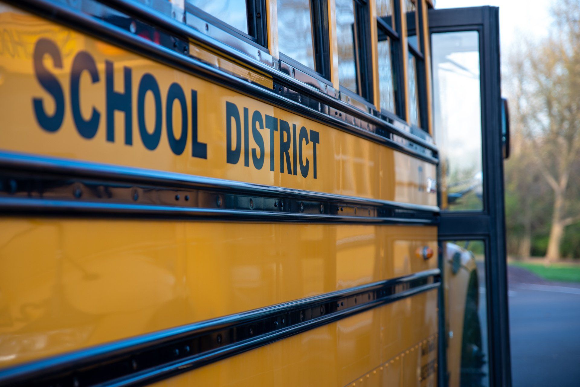 a yellow school bus with the word school district on the side