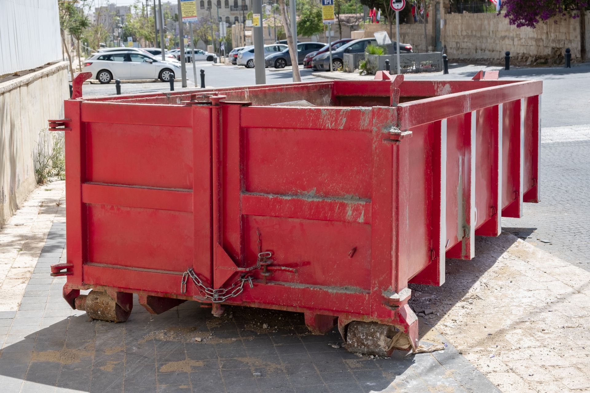 A dumpster showcasing efficient dumpster rental filled with construction rubble at job site.