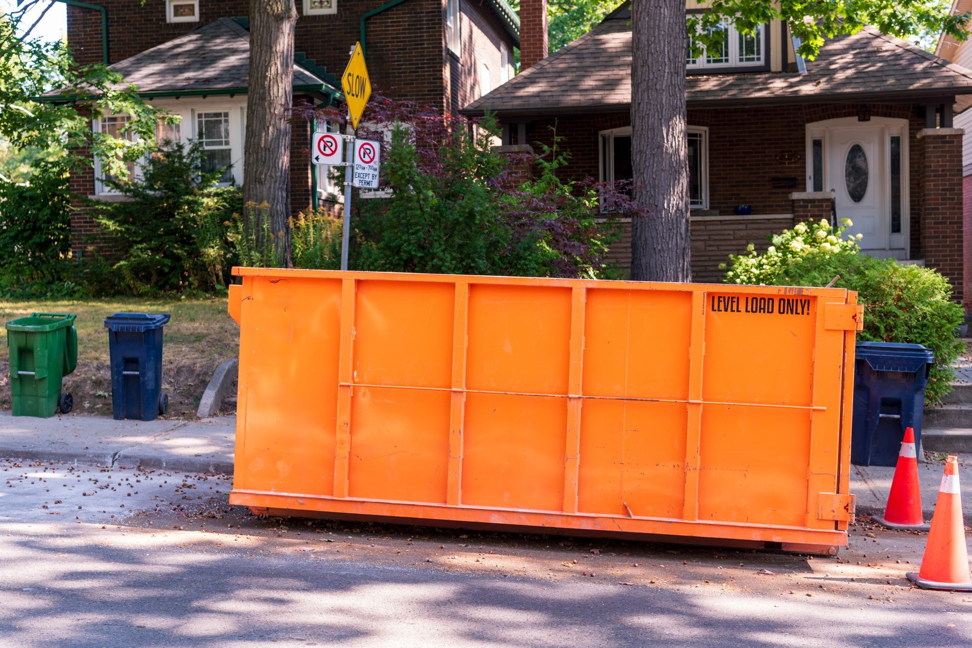 40-yard dumpster rental container placed on residential street for construction debris removal.