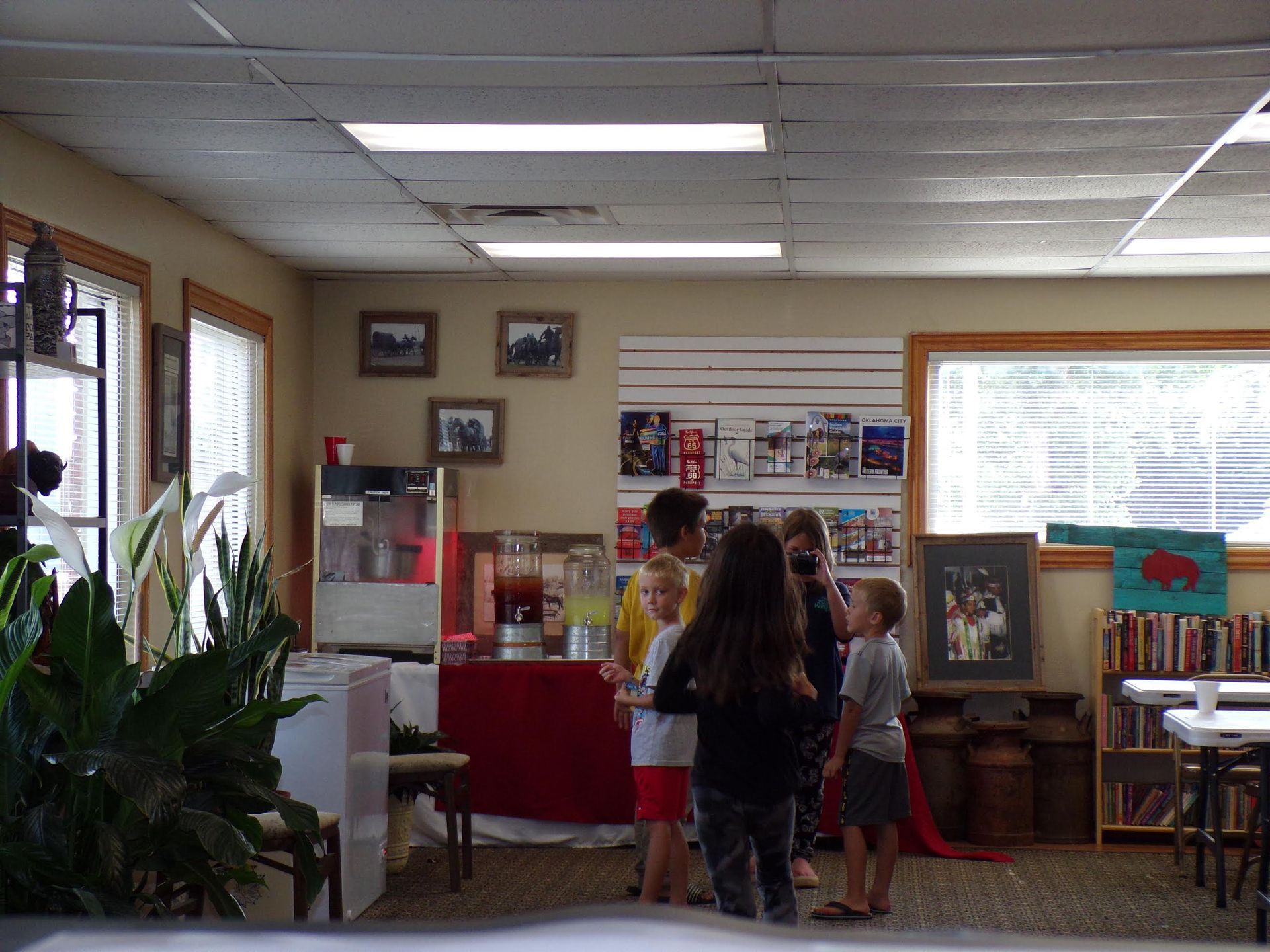 A group of children are standing in a room.