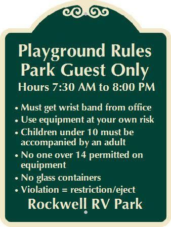 A sign that says playground rules park guest only hours 7:30 am to 8:00 pm
