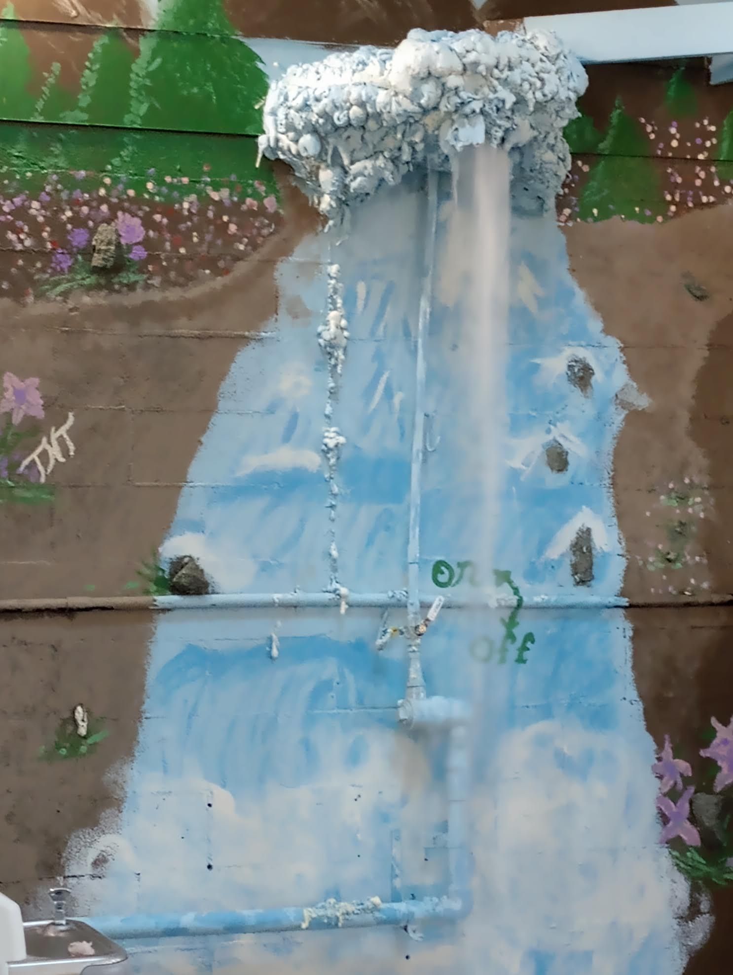 A painting of a waterfall with foam coming out of it