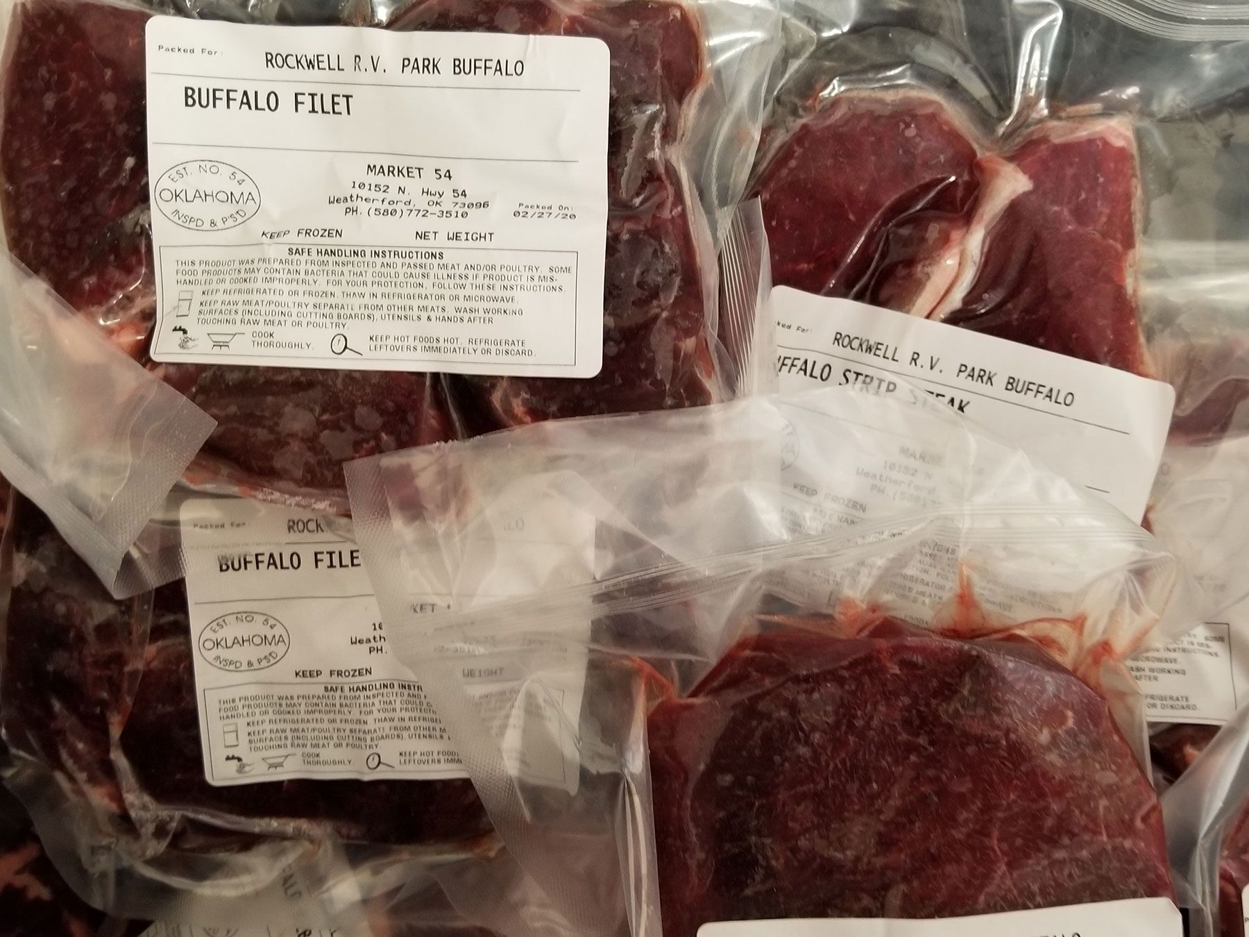 A vacuum sealed bag of buffalo fillets sits on a table