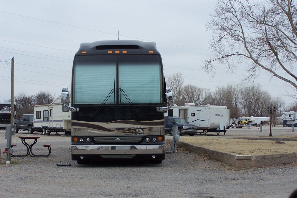 A large bus is parked in a parking lot