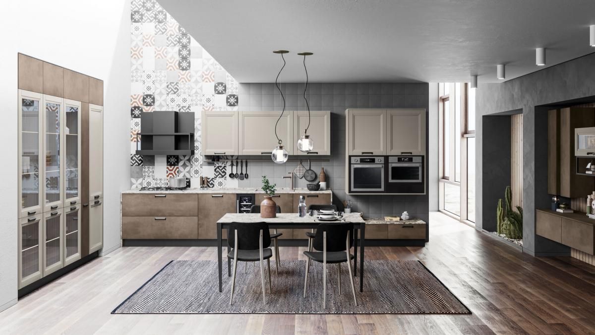 Una cucina con tavolo e sedie e un tappeto sul pavimento.