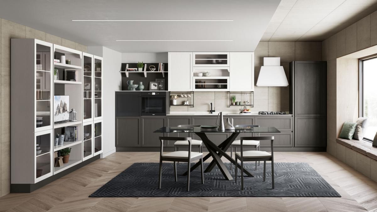 Una cucina con tavolo e sedie