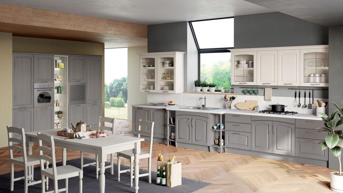 Una cucina con tavolo e sedie