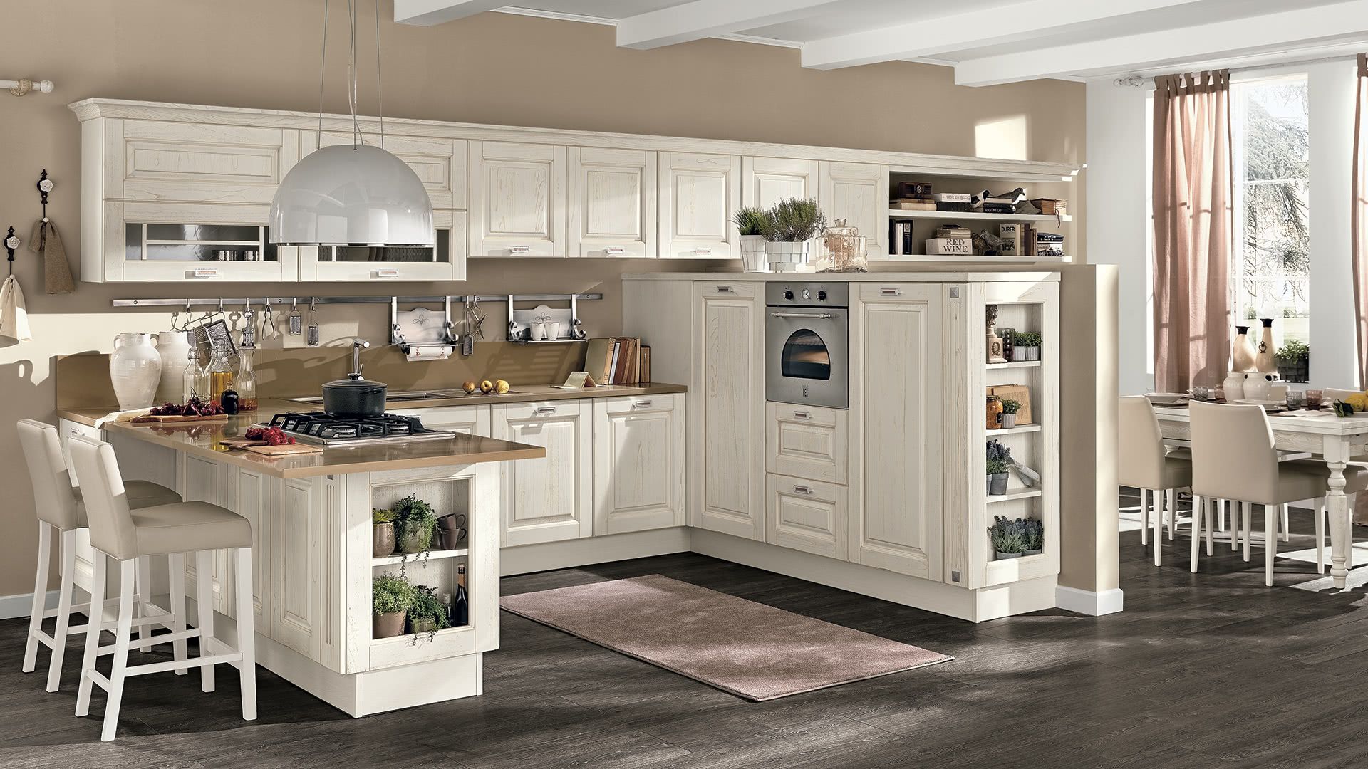 Una cucina con mobili bianchi e una grande isola al centro