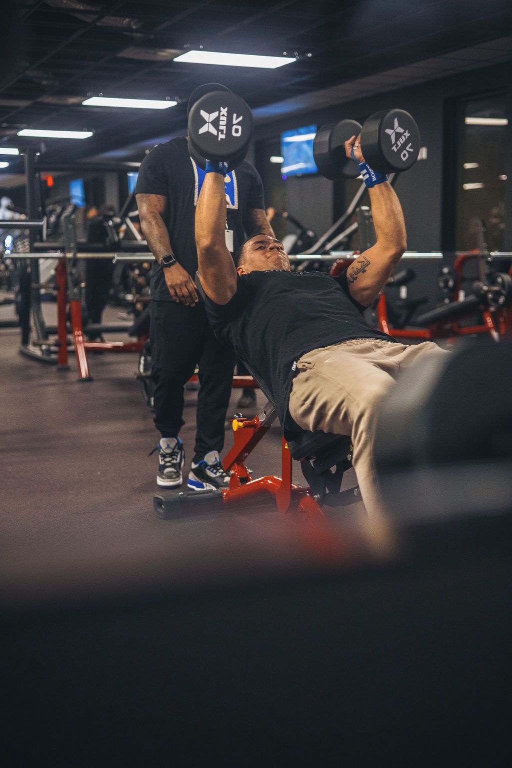 Woman at the gym with his personal coach