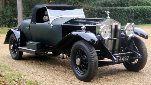 A black car with a license plate that says 4487