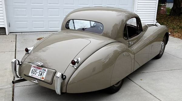 A gray car with a license plate that says a05-287