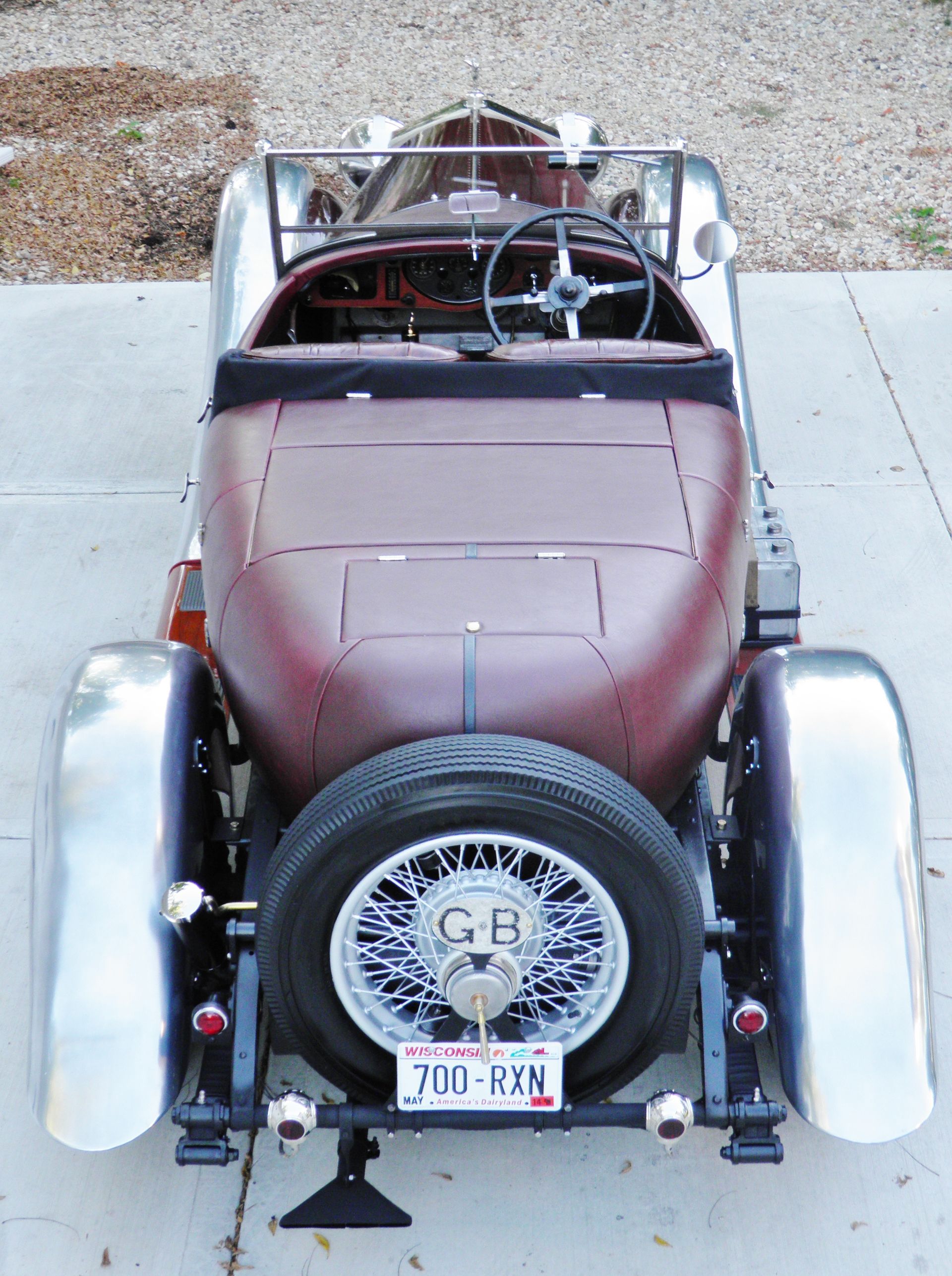 A red car with a license plate that says g.r.