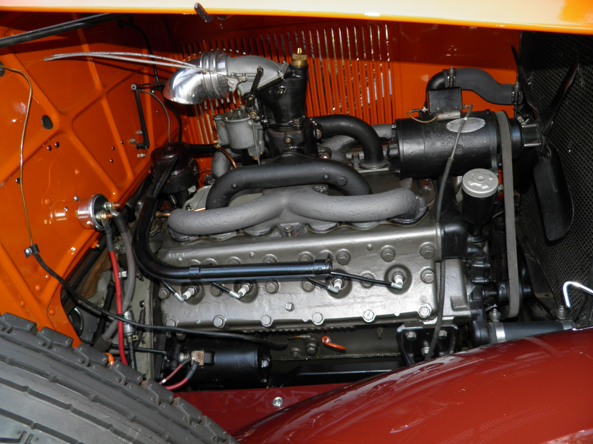 A close up of the engine of an old car