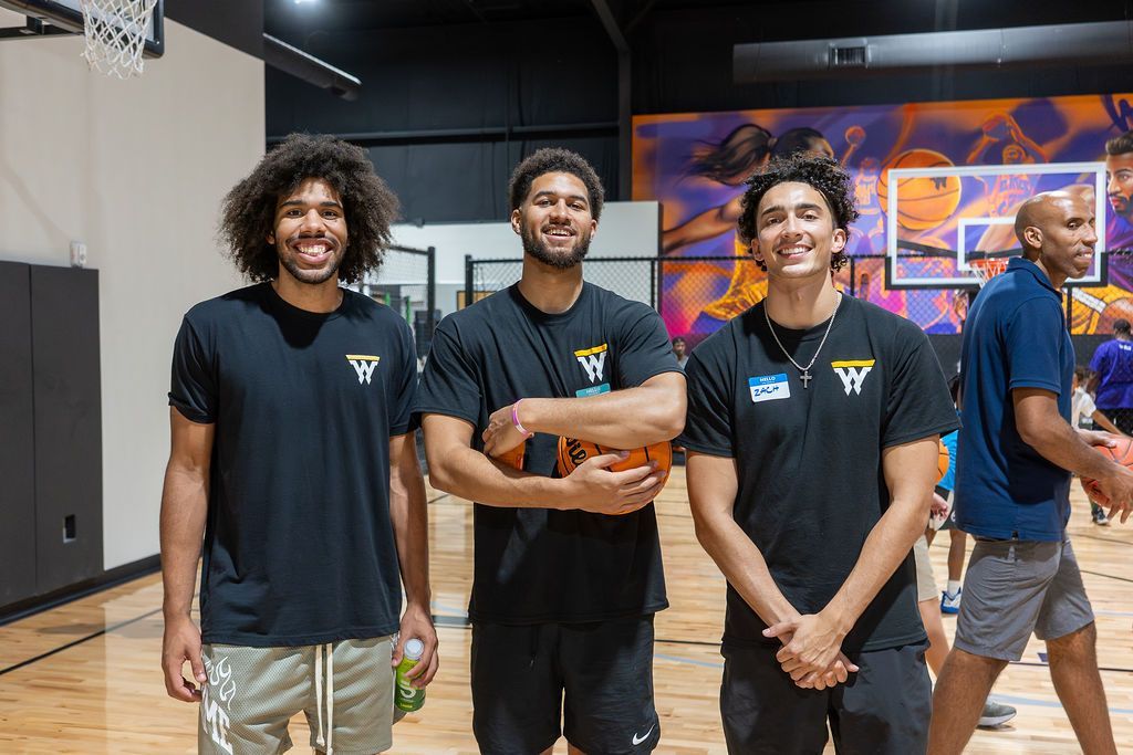 Swysh Den coaches working with players on the court