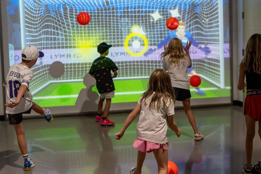 A player using the Interactive Wall at Swysh Den