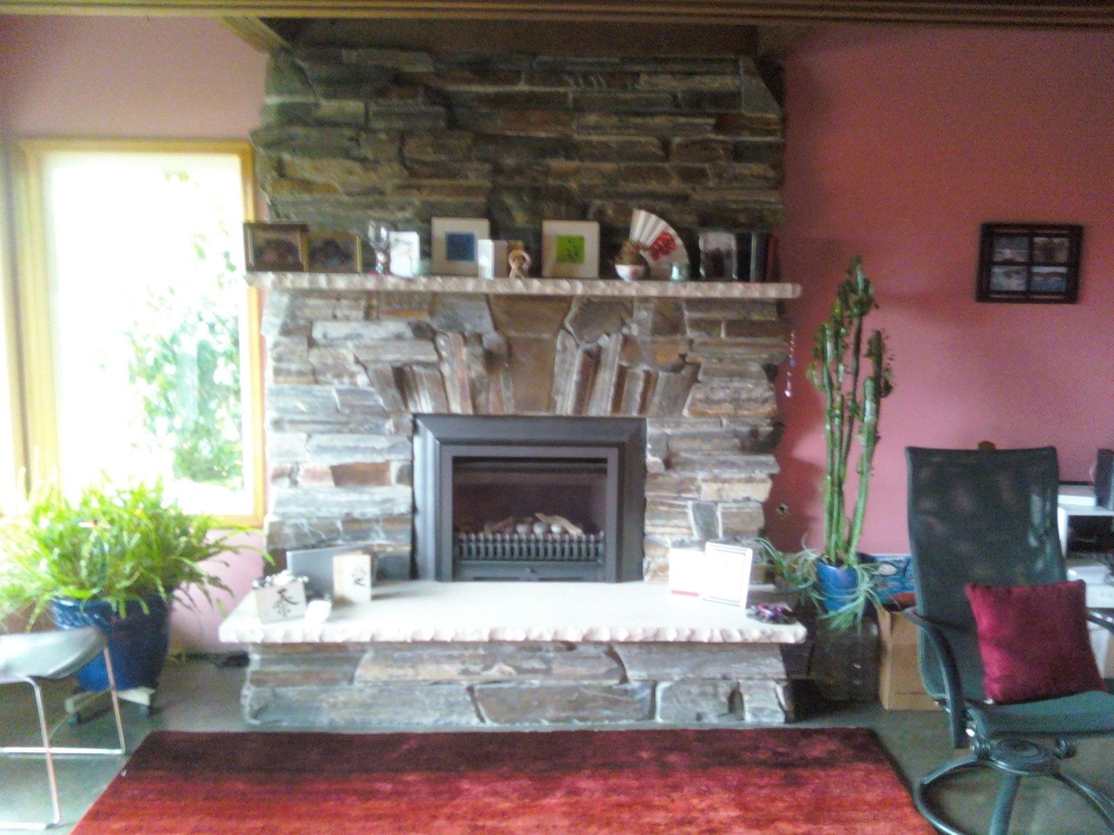 Stone wall with irregularly shaped, tan and gray rocks.