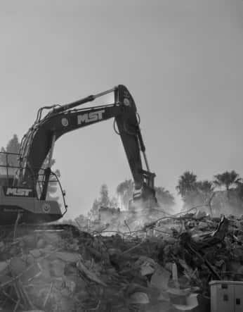 A black and white photo of an excavator