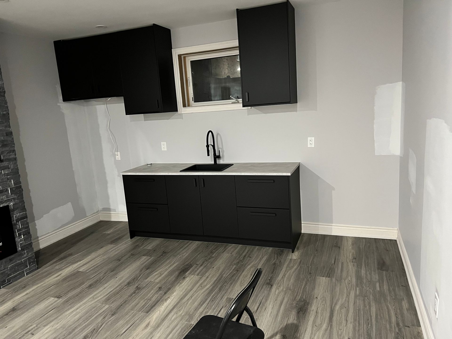 There is a sink in the middle of the room.