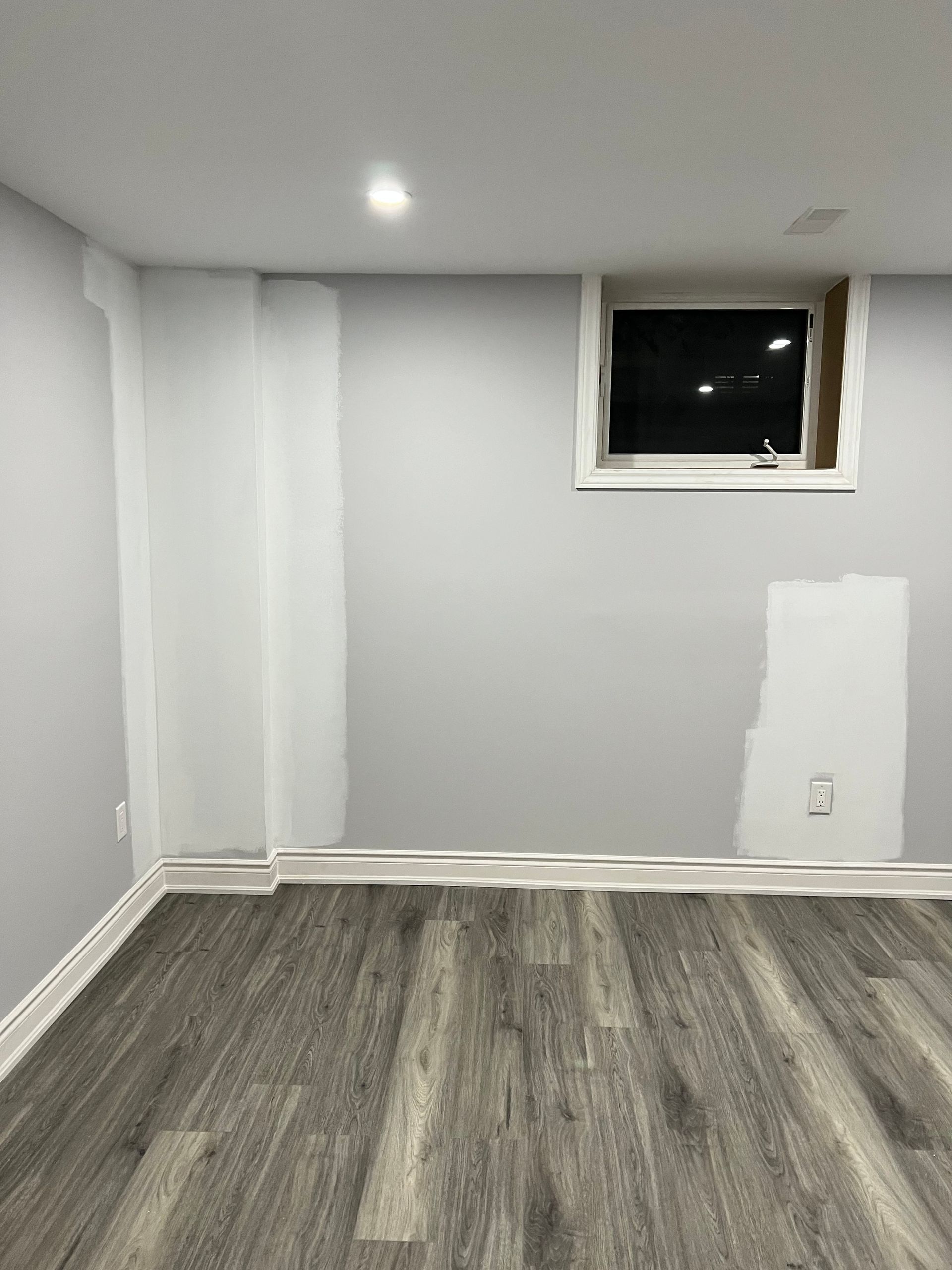 There is a window in the corner of the room.