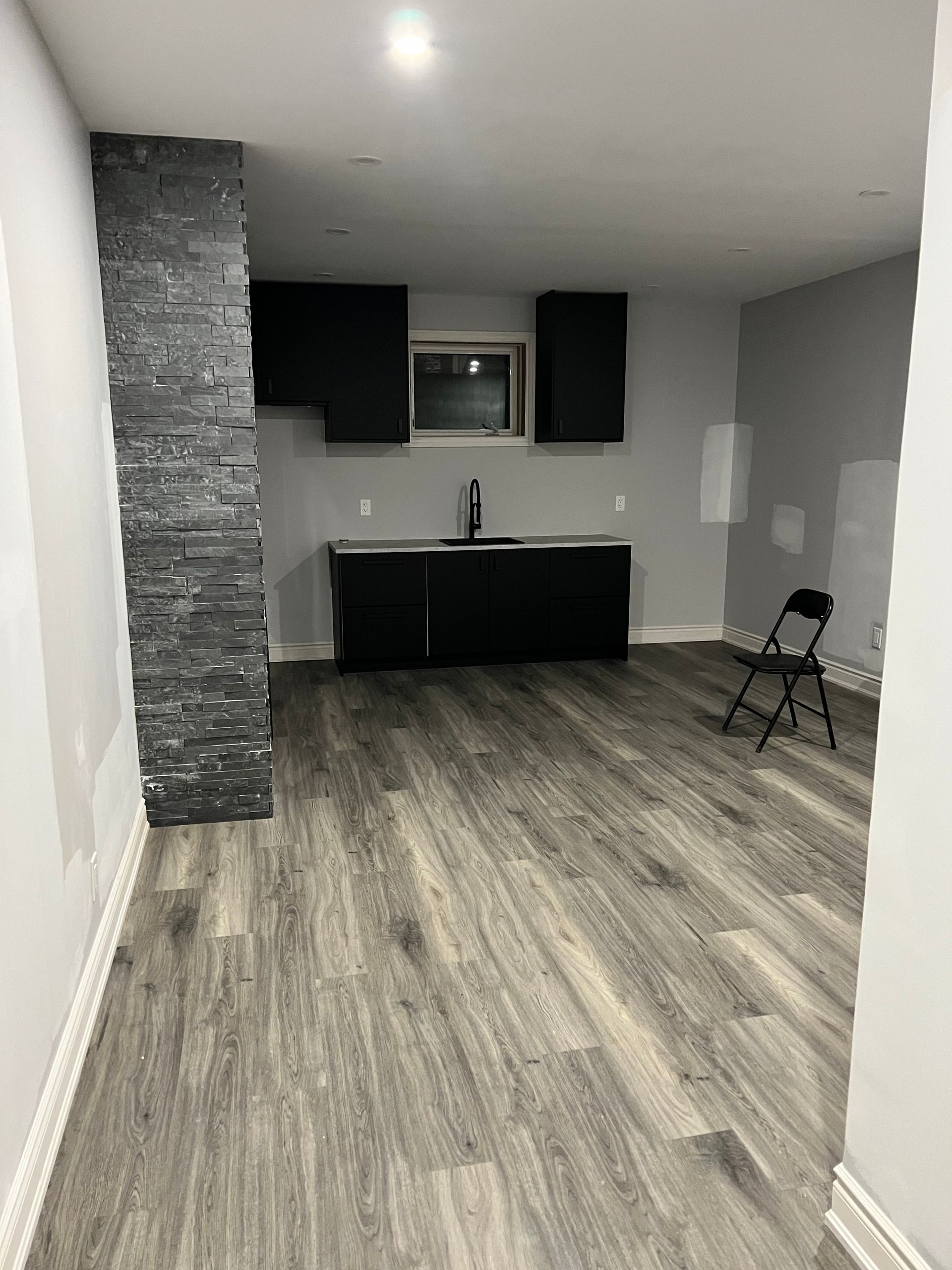 There is a chair in the middle of the room.