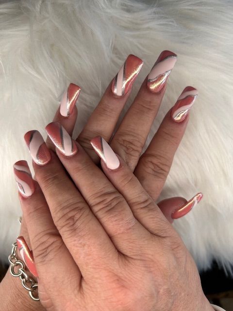 A close up of a woman 's hand with long nails