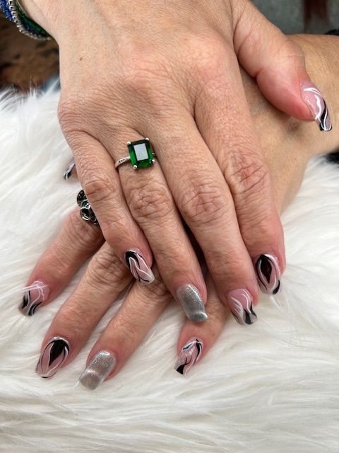 A close up of a woman 's hand with a ring on her finger