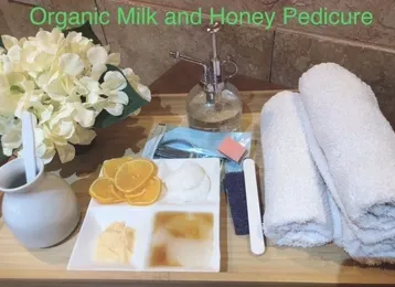 A tray of organic milk and honey pedicure products