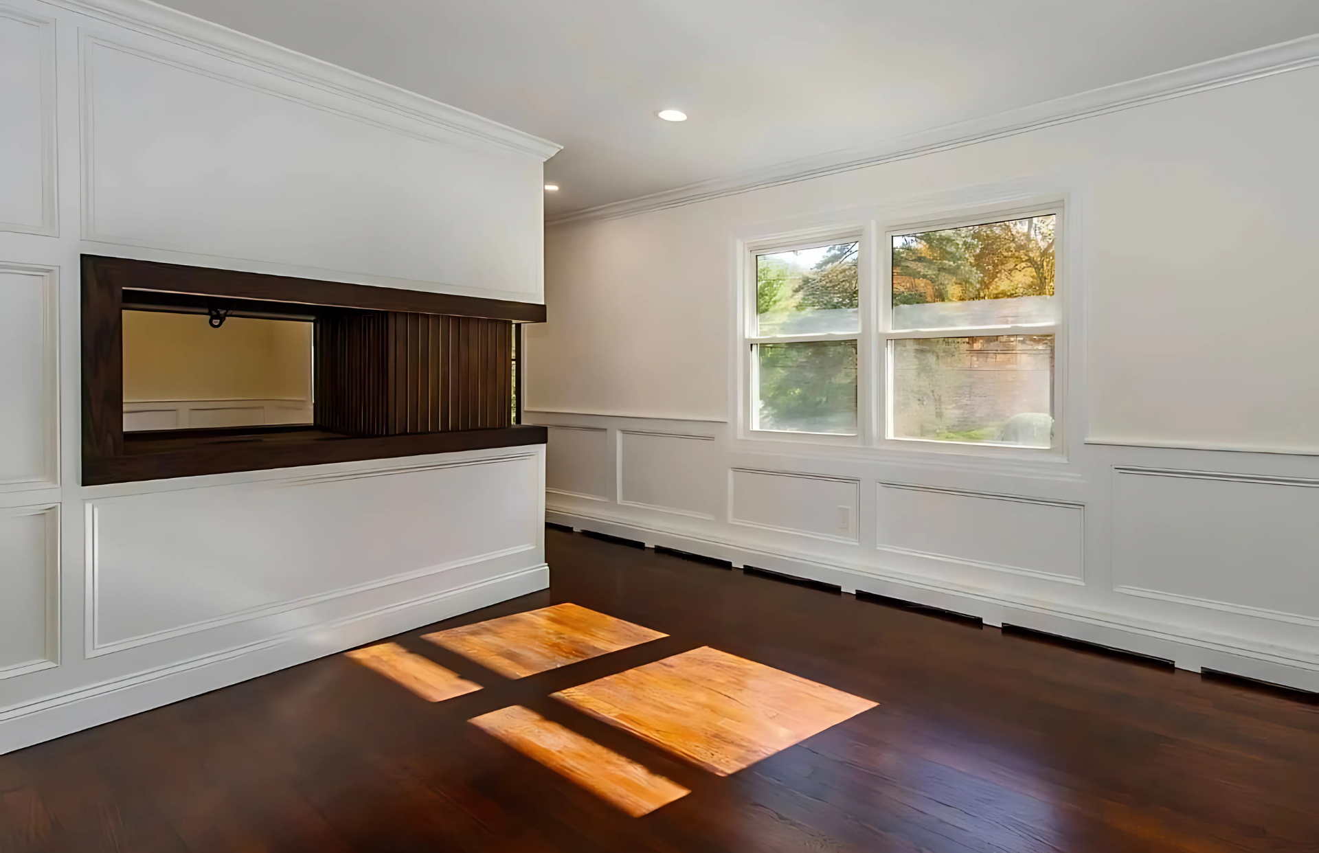A bathroom with a walk in shower and a sink.