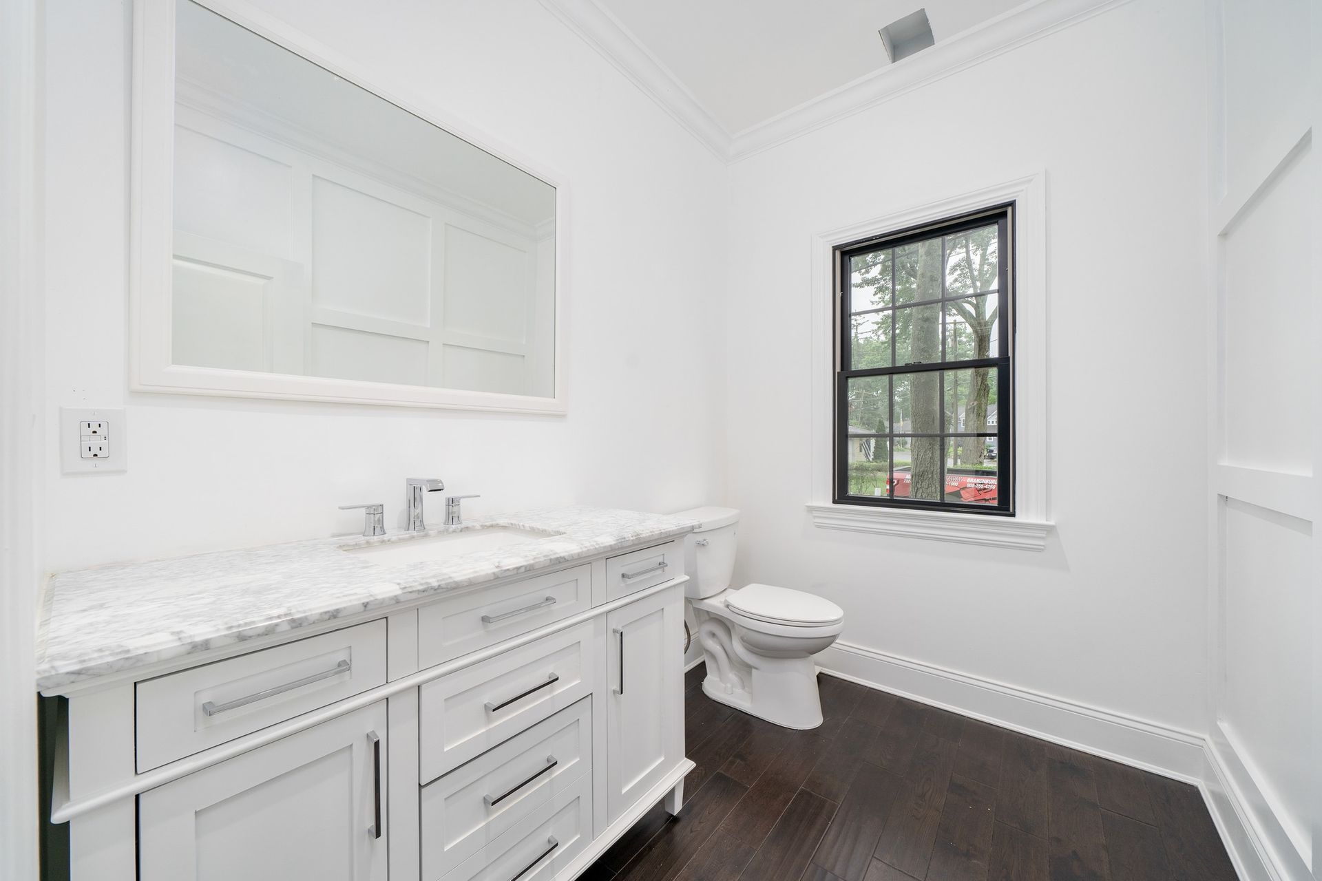 A bathroom with a toilet sink and shower curtain