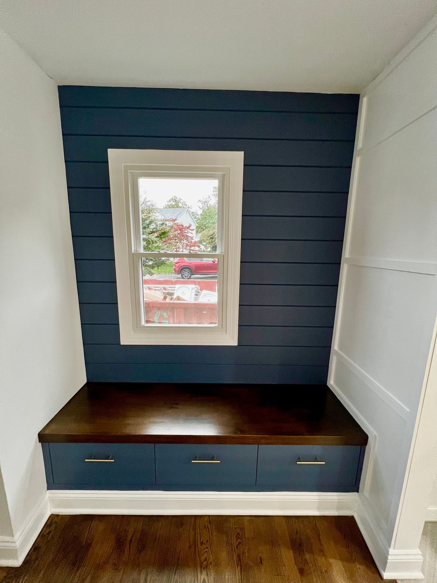 There is a window in the corner of the room.