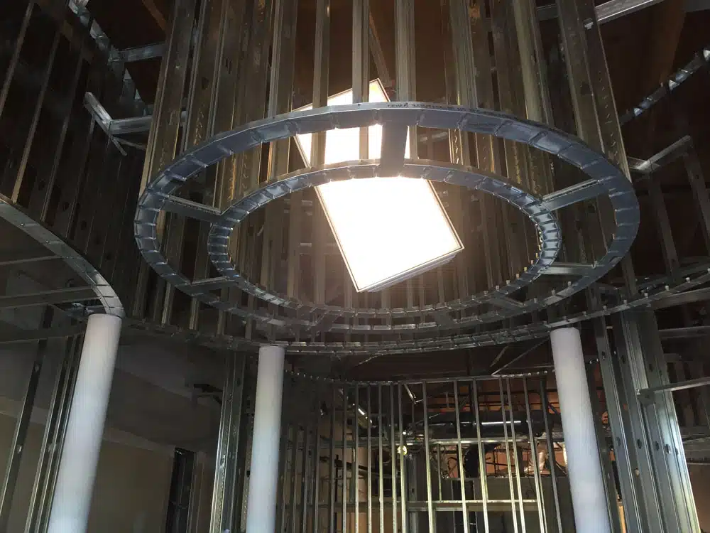 A circular ceiling with a light coming out of it