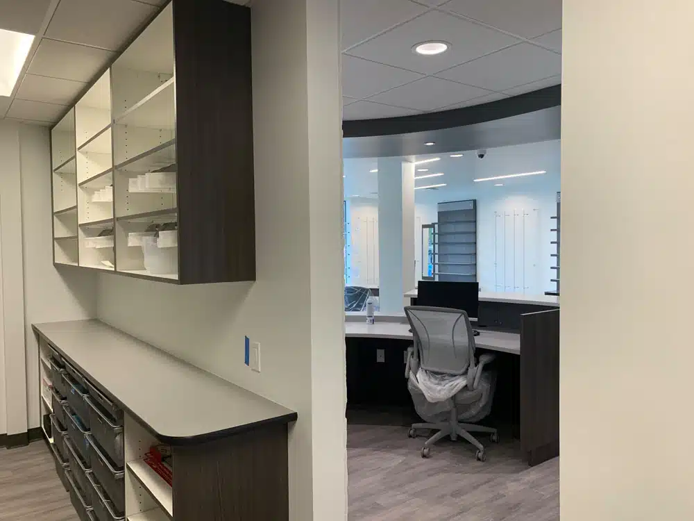 A room with a desk and a chair in it.