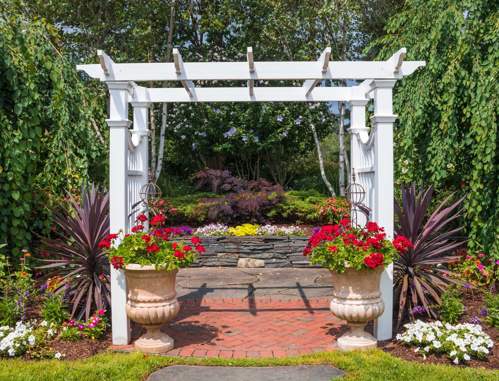 pergola with plants and hardscape pathyway