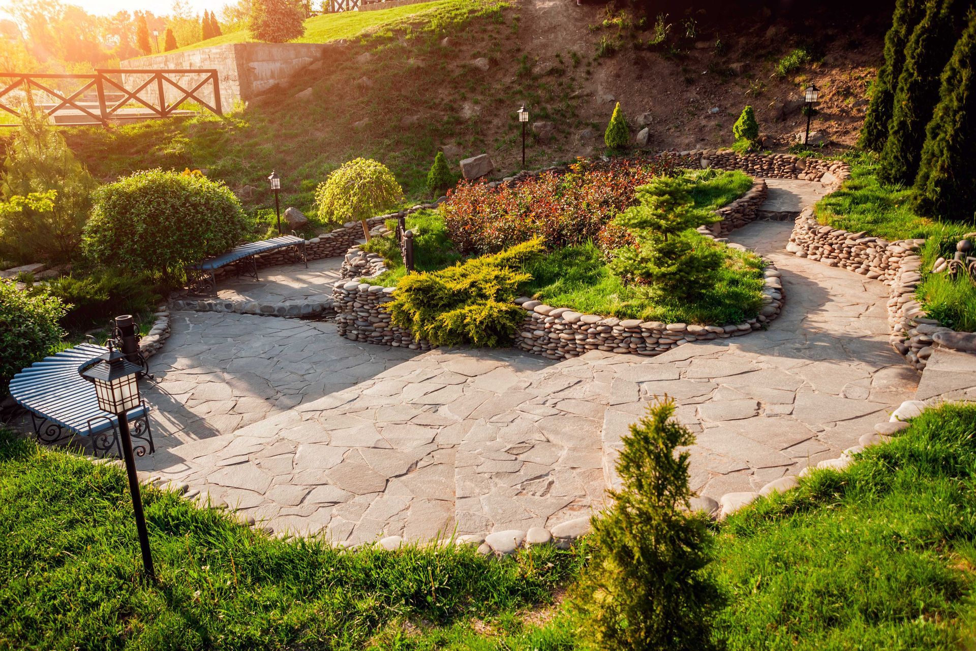 hardscape pathway with plants and a bridge