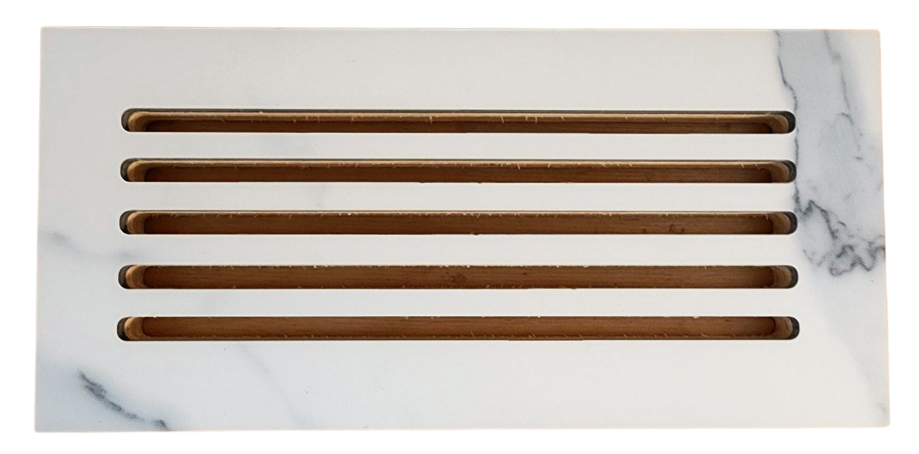 White marble vent cover with six rectangular slots.