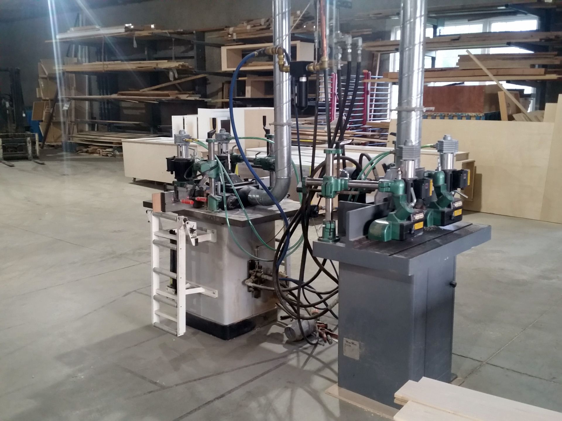 a machine in a warehouse with a ladder attached to it