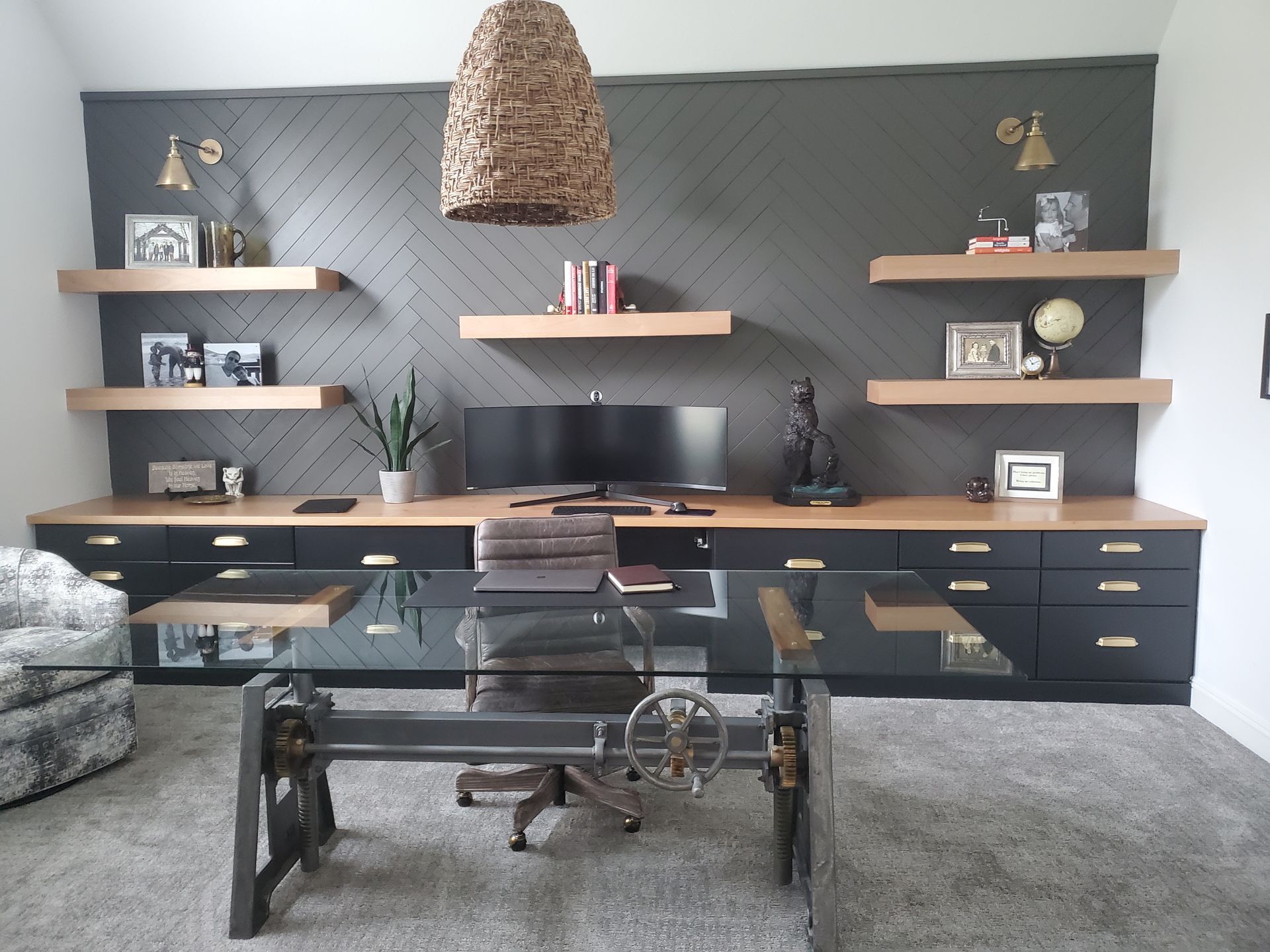 there is a picture of a turtle on the wall above the desk in the office.