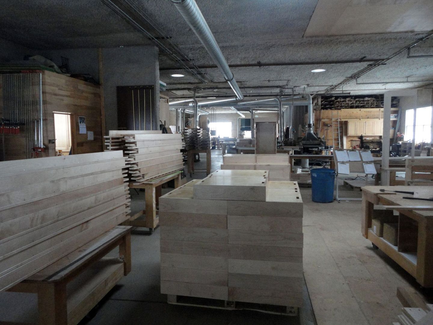 a warehouse filled with lots of wooden boxes