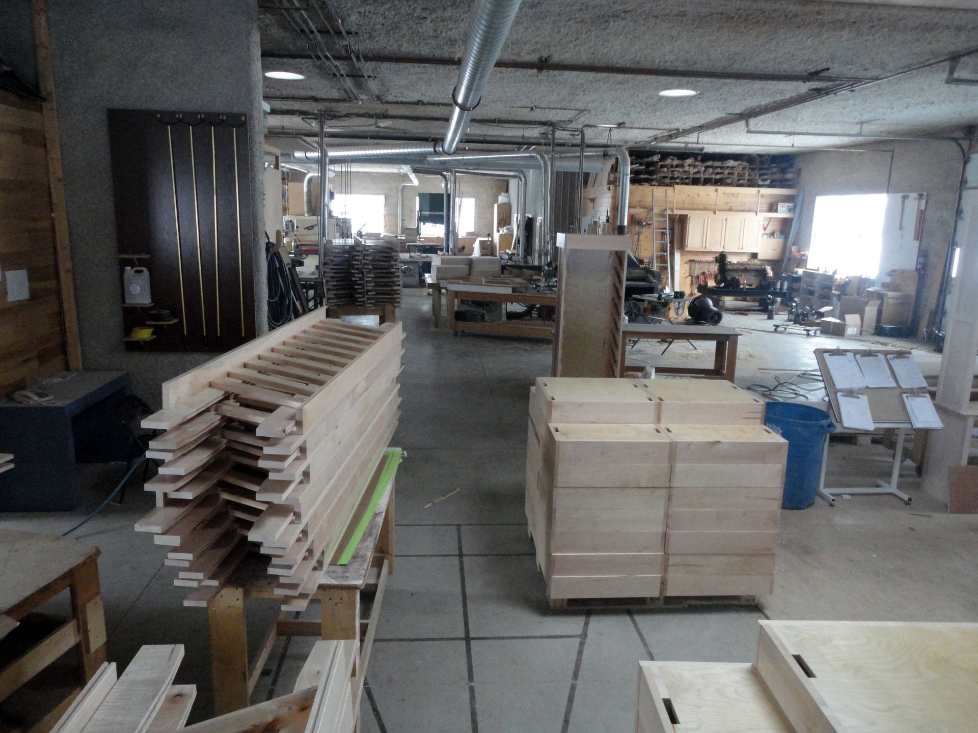 a large room filled with lots of wooden pieces
