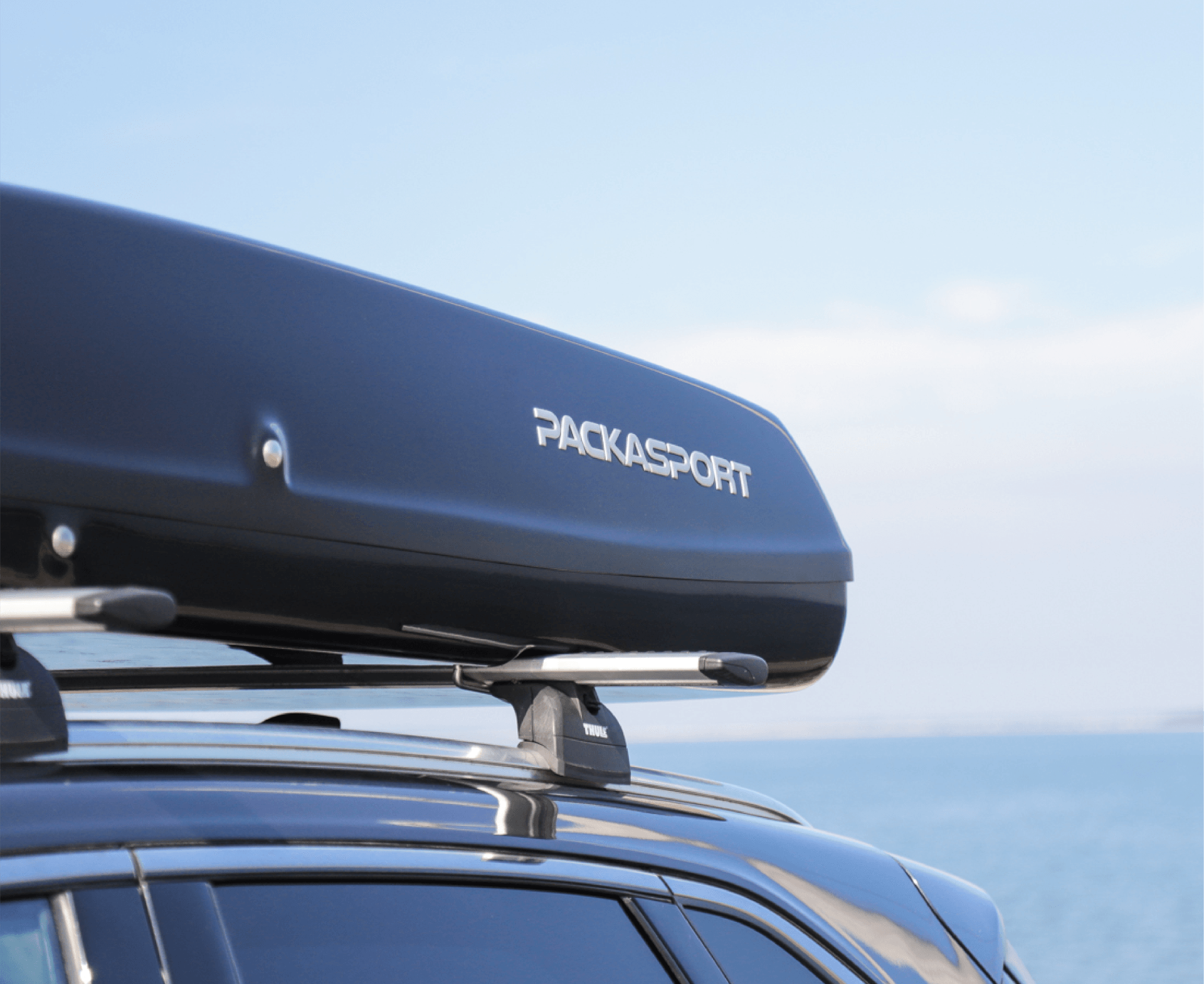 Packasport Rooftop Cargo Box with the word Packasport on it