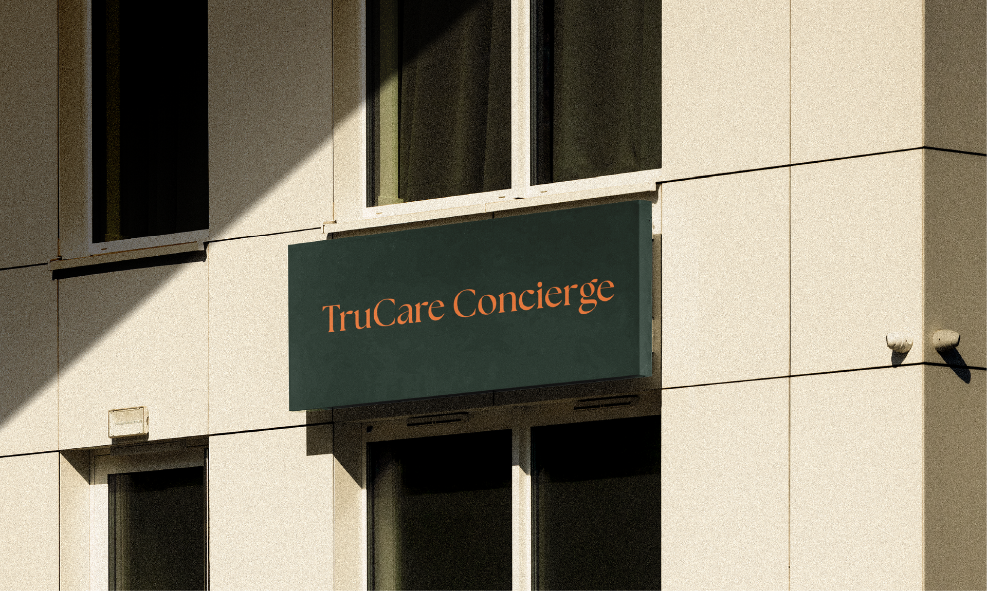 A dark rectangular sign reading 