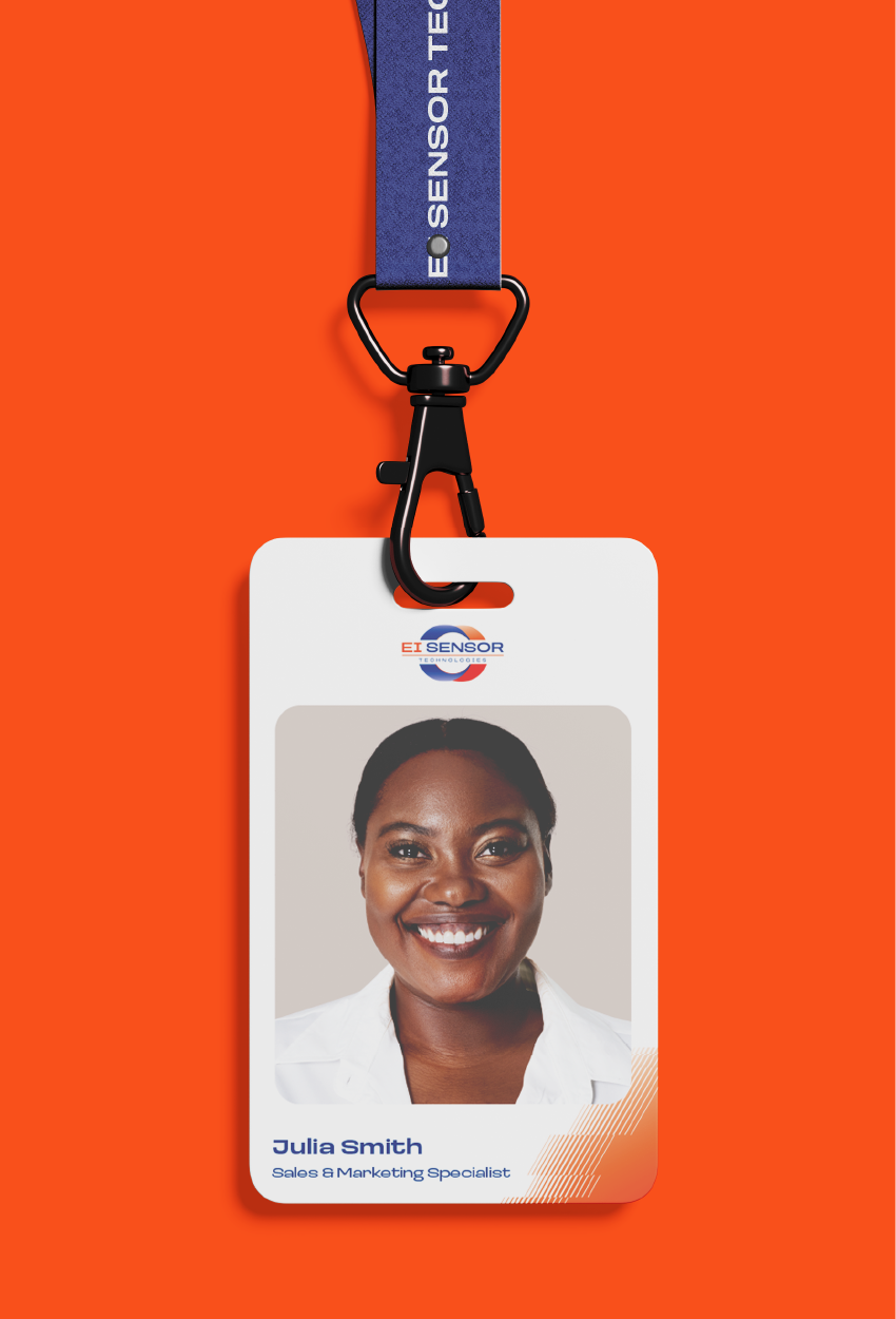 A badge on a blue lanyard against an orange background, featuring a smiling professional’s photo and company branding.